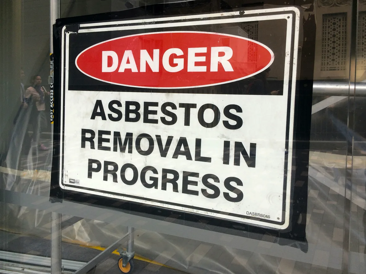 Sign reads: Danger Asbestos removal in progress